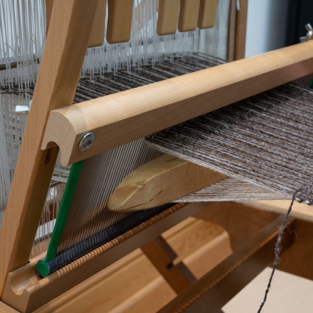 Photo of a double cloth in progress on a table loom